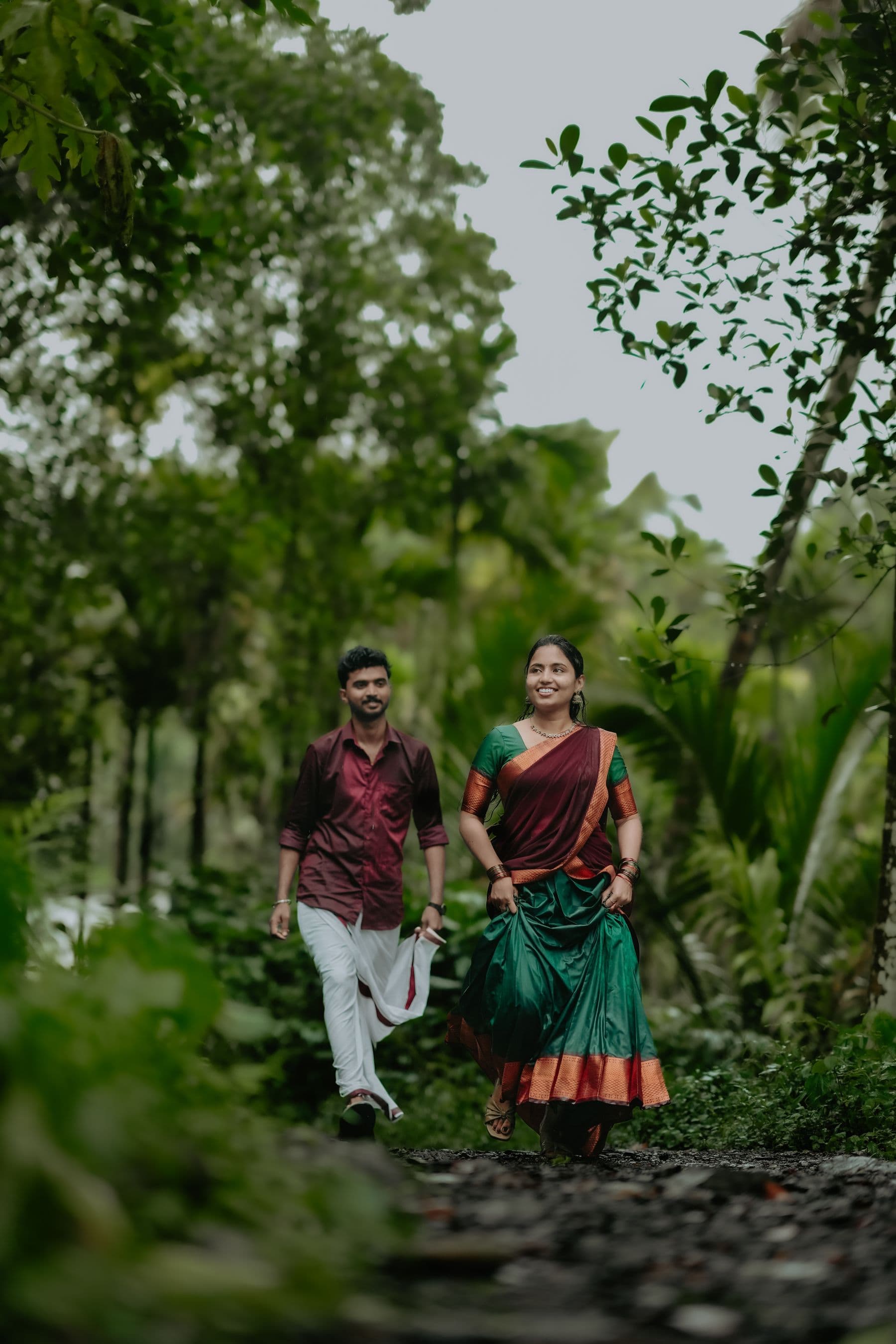 Walking a green pathway, backs to the camera
